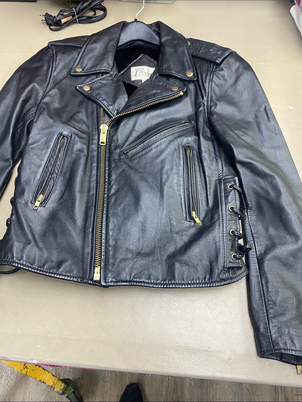 Vtg.Women’s Black Leather Moto Jacket with Gold Hardware and Side Lace-up Detail